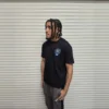 Model wearing the black Core T-Shirt, front, chest logo