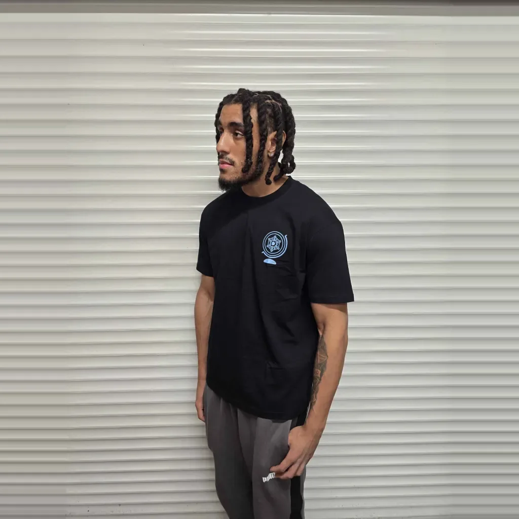 Model wearing the black Core T-Shirt, front, chest logo