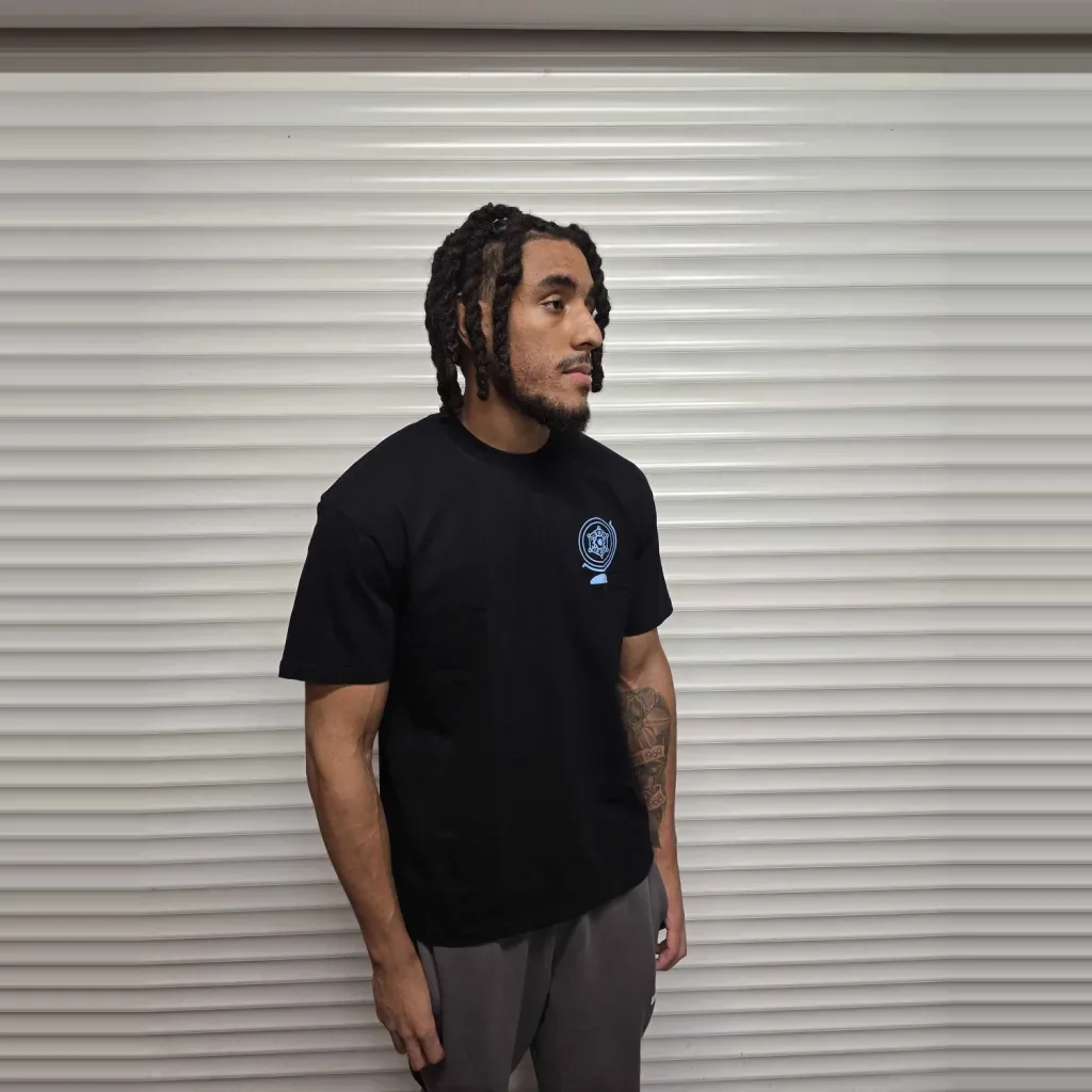 Model wearing the black Core T-Shirt, front, turned to the right